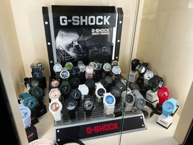 Kyiv, Ukraine - February 09, 2025: Showcasing multiple G-Shock watches in a well-lit display cabinet, highlighting durability and style. clipart