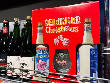 Kyiv, Ukraine - February 11, 2025: A Delirium Christmas box set containing beer bottles and glass, displayed in a store. clipart