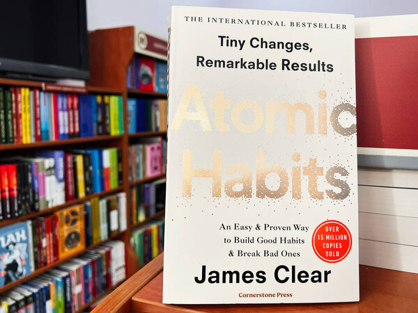 Lviv, Ukraine - February 20, 2025: Bestseller book Atomic Habits  by James Clear displayed prominently in bookstore environment with bookshelves.