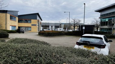 London, UK - February 21, 2025: Office buildings Castles and vehicles in a business park in Enfield, London, UK clipart