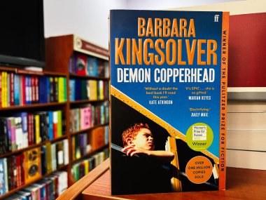 Lviv, Ukraine - February 20, 2025: The book Demon Copperhead by Barbara Kingsolver displayed in a colorful bookstore. clipart