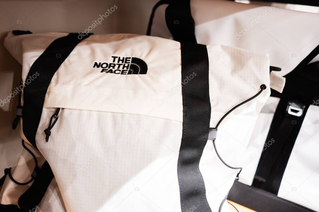 Lviv, Ukraine - March 17, 2025: A stylish white backpack with black accents displayed prominently in The North Face retail store.
