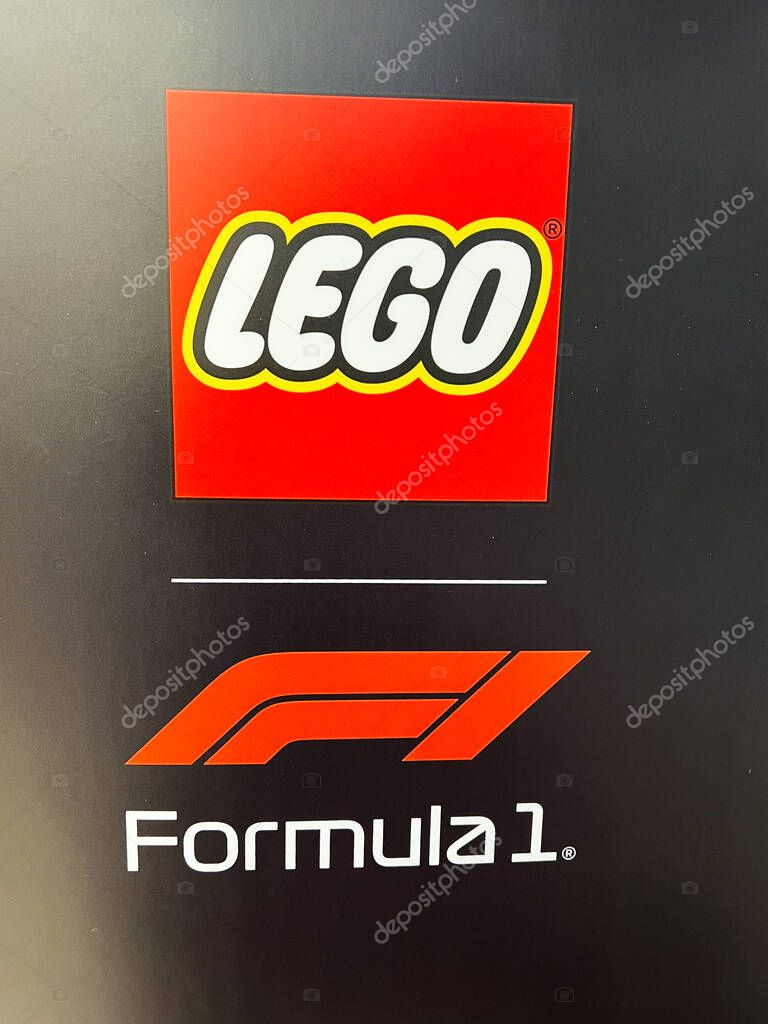 Kyiv, Ukraine - April 08, 2025: Red Lego logo and Formula 1 branding shown prominently on a black surface
