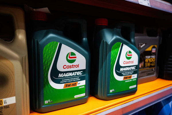 Kyiv, Ukraine - April 14, 2025: Motor oil bottles of Castrol Magnatec brands arranged on shelves inside a retail store.