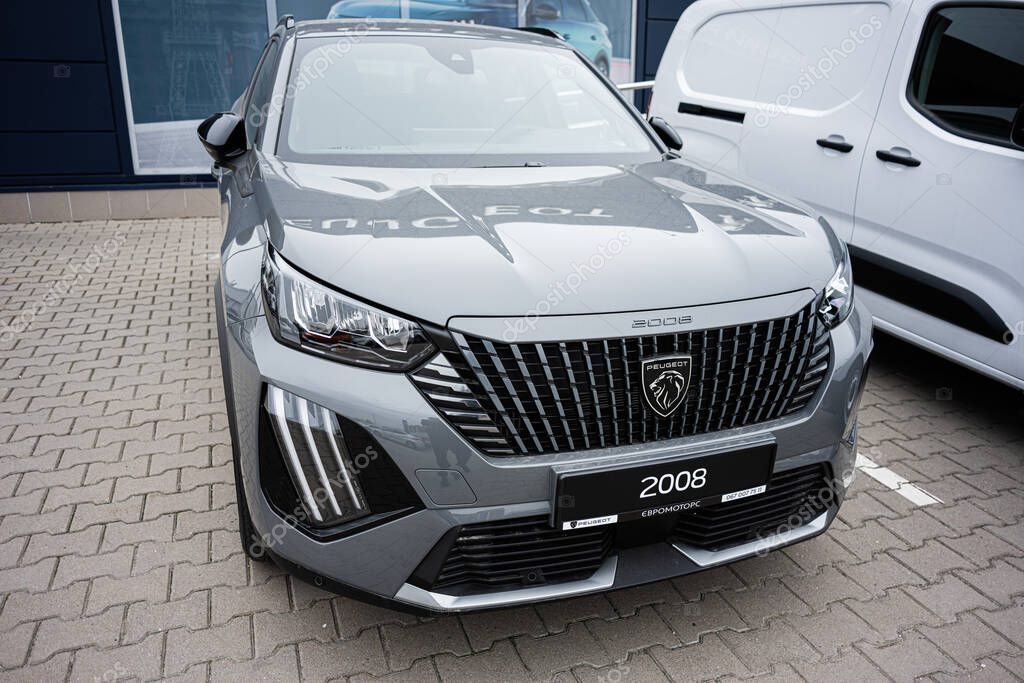 Khmelnytskyi, Ukraine - April 16, 2025: Close-up of a shiny silver Peugeot 2008 SUV car displayed in a parking lot
