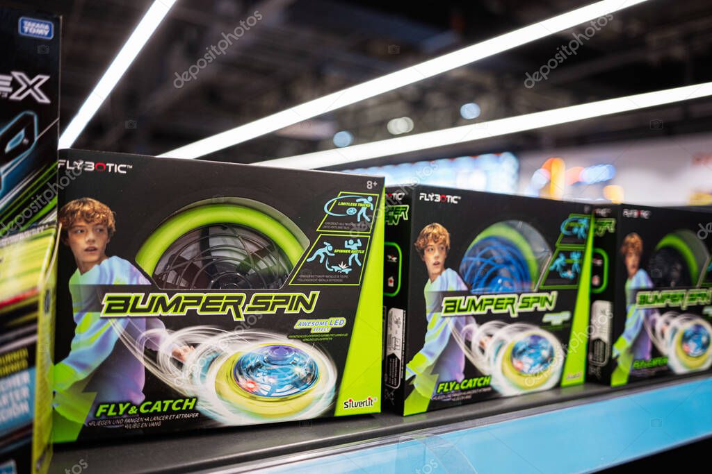 Ivano-Frankivsk, Ukraine - April 29, 2025: Colorful toy boxes labeled 'Bumper Spin' displayed on a vibrant shelf in store
