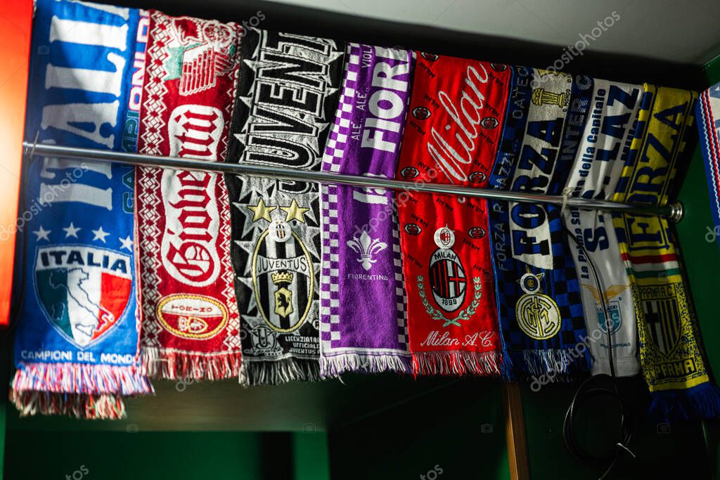 Lviv, Ukraine - May 04, 2025: Collection of football team scarves on a rack showcasing vibrant designs and logos
