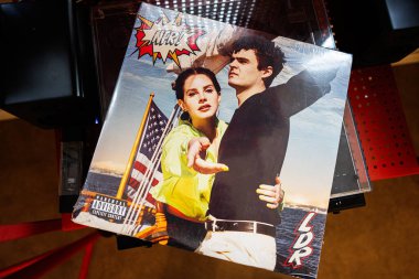 Lviv, Ukraine - May 13, 2025: Closeup of Lana Del Rey vinyl record Norman Fucking Rockwell! album with artistic cover artwork. 