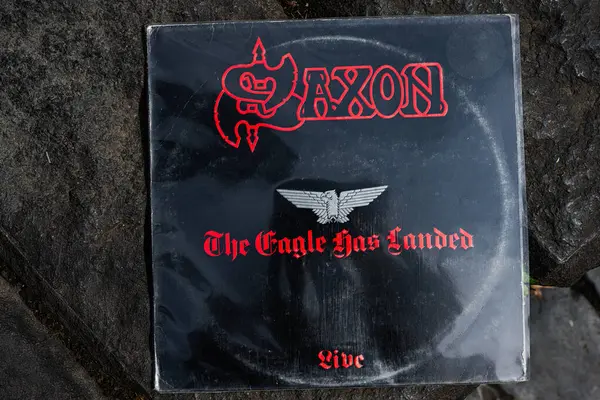 Lviv, Ukrayna - 13 Mayıs 2025: Saxon 'un 1982 tarihli ikonik albümü The Eagle Has Landed on stone surface 