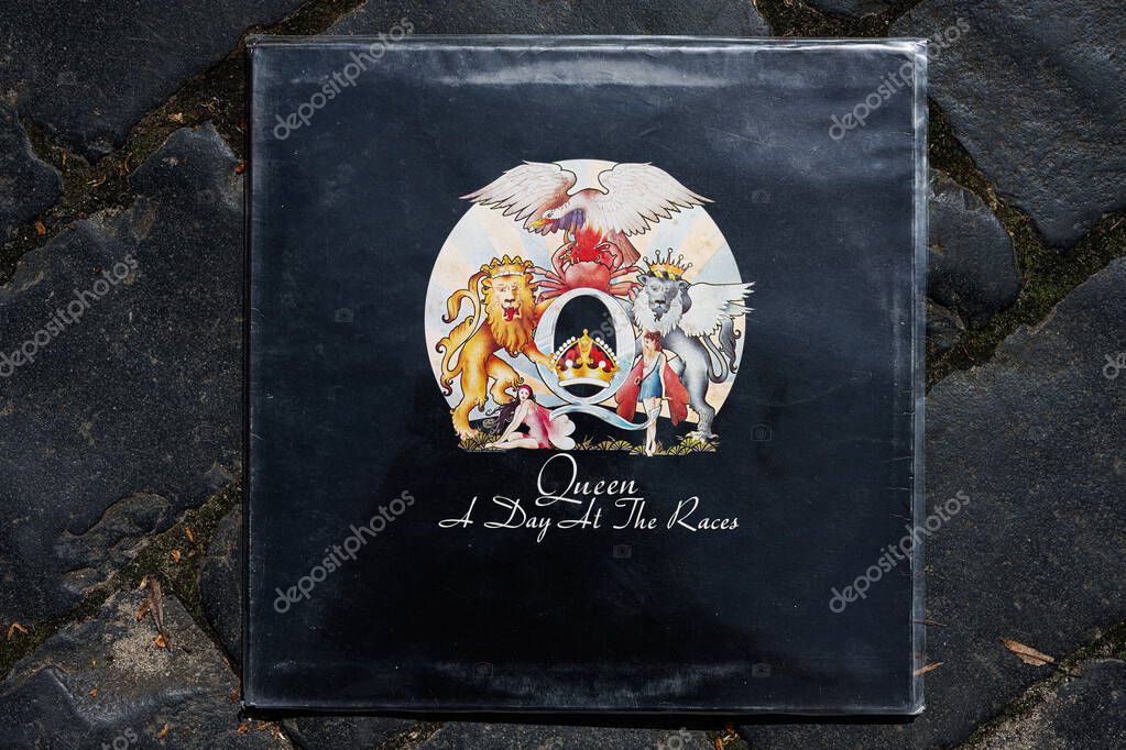 Lviv, Ukraine - May 13, 2025: Close-up of A Day At The Races album 1976 cover by Queen on cobblestone path