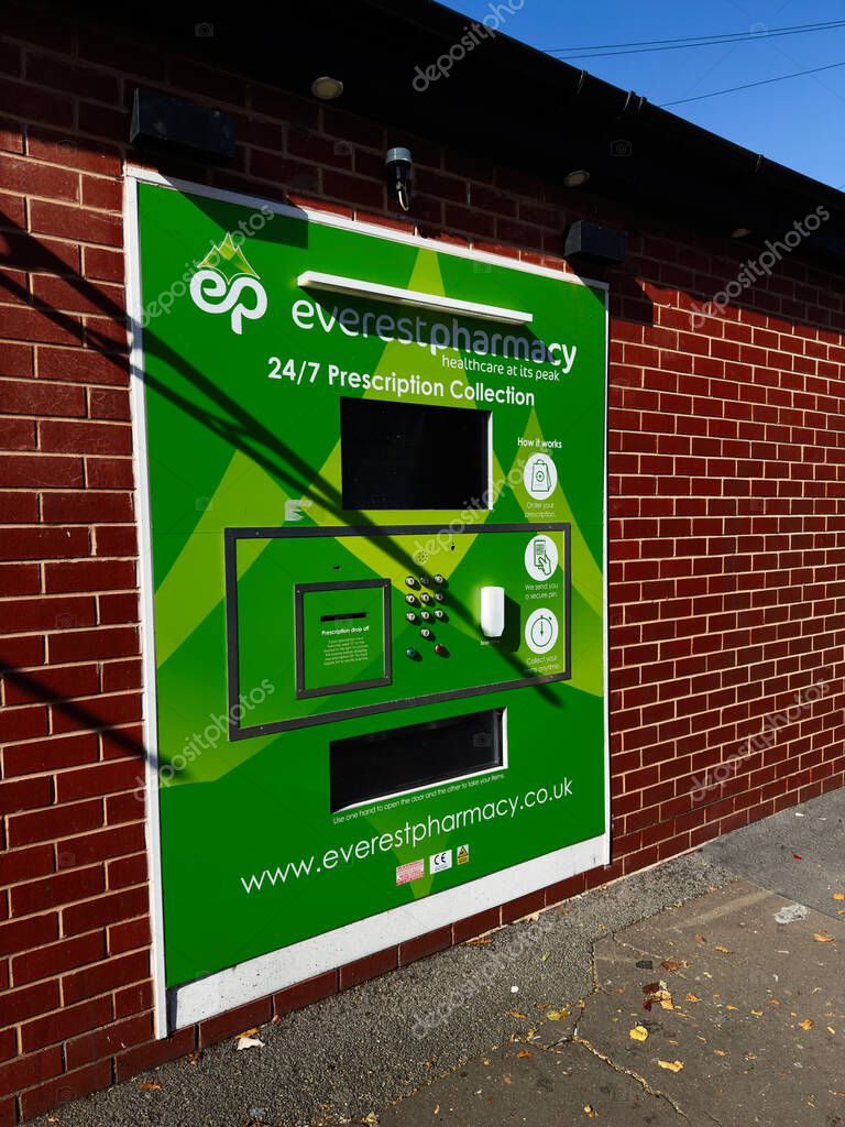 Manchester, UK - September 23, 2025: Green Everest Pharmacy vending machine provides 24/7 prescription collection in Manchester.