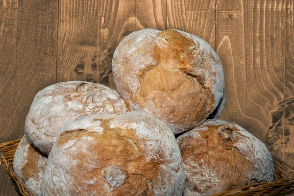 close-up shot of basket with handmade bread loaves
