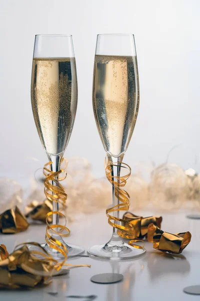 stock image two glasses of champagne on a table in a festive atmosphere. generated by AI