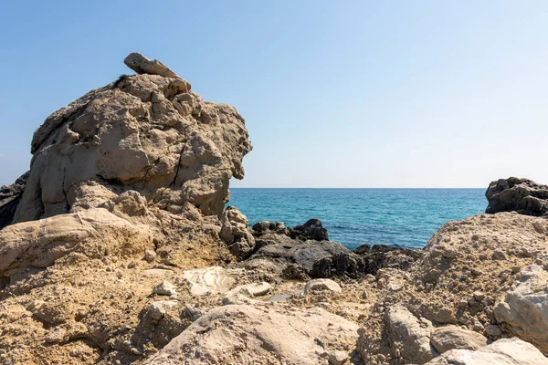 stock image rocky coast on a sunny day a calm sea