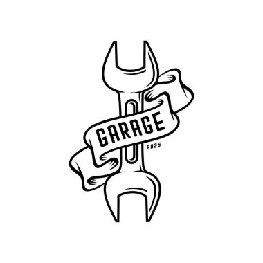 Garajda yazılı olan kurdeleye sarılı İngiliz anahtarı.