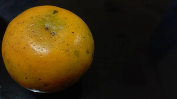 Orange Bit Freckles Left Black Table — Stock Photo, Image