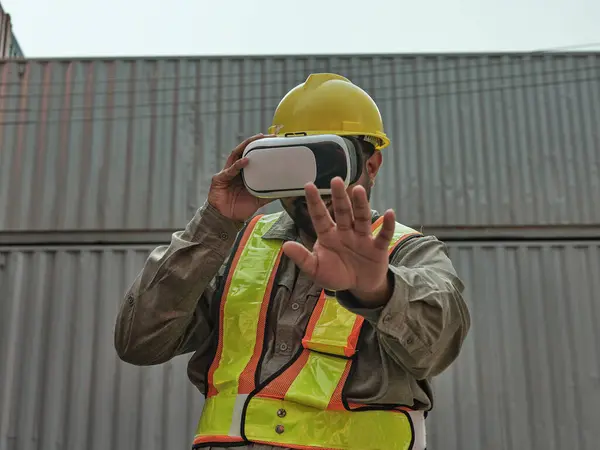 stock image Engineer wearing an augmented reality headset and using gestures to control objects in augmented reality.