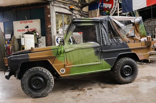 stock image Troyes, France - Sept. 2020 - Side view of a Peugeot P4, an off-road liaison vehicle formerly used by the French Army, based on the Mercedes G-Class and exhibited in a museum of military cars