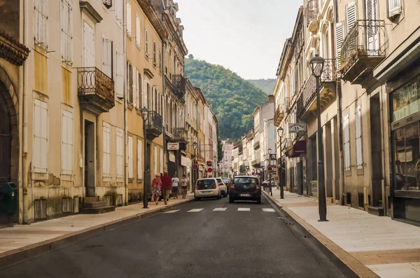 stock image Mazamet, France - Aug. 2018 - Perspective of a street in the town centre of Mazamet, lined by old traditional houses at the foot of the Montagne Noire, in the mountains of the Park of Haut-Languedoc