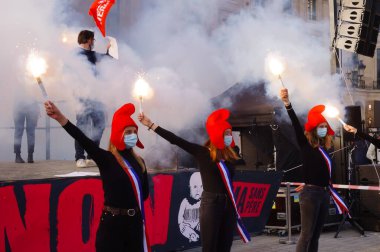Paris, France - Oct. 10, 2020 - Group of cheerful young female supporters of La Manif pour Tous, dressed up as French 
