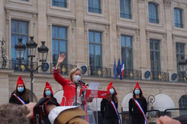 Paris, France - Oct. 10, 2020 - Group of cheerful young female supporters of La Manif pour Tous, dressed up as French 