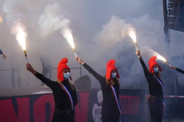 Paris, France - Oct. 10, 2020 - Group of cheerful young female supporters of La Manif pour Tous, dressed up as French 