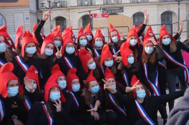 Paris, France - Oct. 10, 2020 - Group of cheerful young female supporters of La Manif pour Tous, dressed up as French 