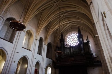 Toulouse, France - March 2020 - Imposing loft organ on the grandstand of the baroque church of Saint-Pierre des Chartreux (Saint Peter of the Carthusian monastery), featuring richly carved wood