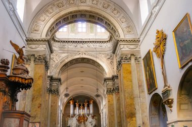 Toulouse, France - March 2020 - Imposing loft organ on the grandstand of the baroque church of Saint-Pierre des Chartreux (Saint Peter of the Carthusian monastery), featuring richly carved wood