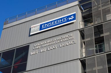 Toulouse, France - Feb. 2023 - Main building of ENSEEIHT (Polytechnic Institute), an engineering school in electronics, hydraulic, information technology and telecommunications, in Dupuy District clipart