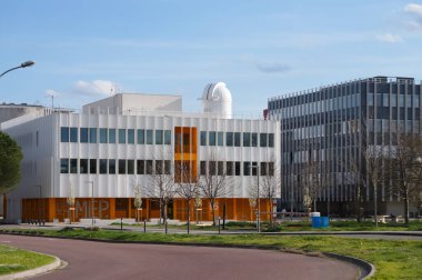 Toulouse, France - March 15, 2024 - MEP U6 and MRL U5, two of the newest buildings on the Rangueil Campus of Toulouse III-Paul Sabatier University; U6 has the OJBT observatory on top of the roof clipart