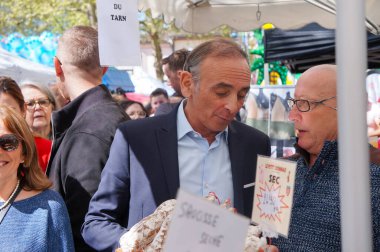 Bessieres, France - April 1, 2024 - Eric Zemmour's walkabout at the village market during the Easter Giant Omelette, amid the campaign for the European elections; he is the president of 