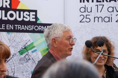 Toulouse, France - April 17, 2024 - Jean-Claude Dardelet, vice-president of Toulouse Metropole, deputy-mayor and vice-president at Thales Alenia Space, at the opening of an outdoor exhibition clipart