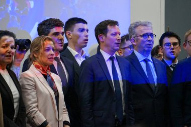 Toulouse, France - April 26, 2024 - Surrounding MEP F.-X. Bellamy at a rally, Republican leading candidate for the European elections at a rally, running mates C. Imart, C. Gomart, mayor B. Barges clipart