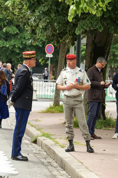 stock image Toulouse, France - May 8, 2024 - General Arnaud Girault (?), 2nd-in-command in Occitanie Region of Gendarmerie, talks with Lieutenant-Colonel Frdric Laprevotte, Head of 1st RCP, on Victory Day