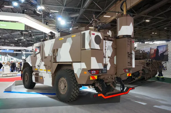 stock image Paris Nord Villepinte, France - June 20, 2024 - Nexter's multipurpose armored vehicle VBMR-L Serval, showcased on the exhibition booth of the French Ministry of Armed Forces at Eurosatory Arms Fair