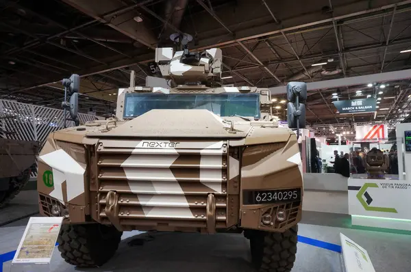 stock image Paris Nord Villepinte, France - June 20, 2024 - Nexter's armored vehicle Griffon in mountain camouflage, on display on the exhibition stand of the French Ministry of Armed Forces at Eurosatory Show