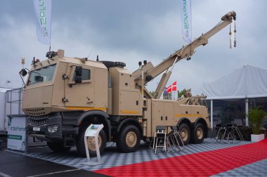 Paris Nord Villepinte, France - June 20, 2024 - PRV (Protected Recovery Vehicle), a tow truck and mobile crane by French manufacturer Soframe, based on a Mercedes-Benz 8x8 chassis, at Eurosatory Fair clipart