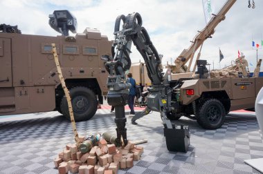 Paris Nord Villepinte, France - June 19, 2024 - Fardier MkII, a mine clearance Unmanned Ground Vehicle (UGV) shown on the booth of its French manufacturer Soframe (Lohr Group), at Eurosatory Arms Show clipart