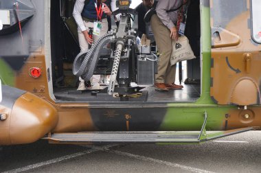 Paris Nord Villepinte, France - June 25, 2024 - 12.7mm Browning M2 machine gun onboard a French Army's NH90 Caman battlefield helicopter, exhibited during the 2024 Eurosatory International Arms Show clipart