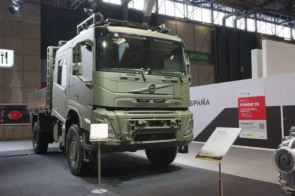 stock image Paris Nord Villepinte, France - June 20, 2024 - FMX 4x4 army truck in khaki military camouflage exhibited on the booth of Swedish manufacturer Volvo Defense, at Eurosatory International Arms Show