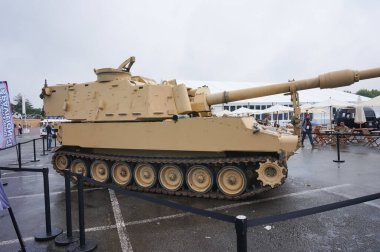 Paris Nord Villepinte, France - June 20, 2024 - United States Army M109, a track-laying 155 mm self-propelled howitzer from manufacturer BAE Systems, on display at Eurosatory International Arms Fair clipart