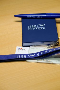 Toulouse, France - Oct. 10, 2024 - Goodies and accessories from ISAE-SUPAERO, the French Higher Institute of Aeronautics and Space, a prestigious school of engineers under the Ministry of Defence  clipart