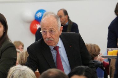 Quint, France - Dec. 5, 2024 - Mayor of Saint-Orens-de-Gameville, Colonel Serge Jop, attends the end-of-year event of the Republican Federation of Haute-Garonne clipart