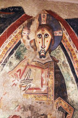 Barcelona, Catalonia - August 7, 2022: Close uo of Christ Pantocrator in a medieval fresco, Barcelona. From National Museum of Art of Catalonia.