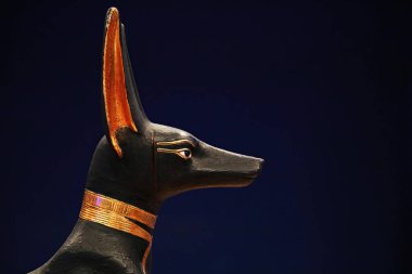 Profile of Anubis statue from Tutankhamun treasure, original crafted from wood and gold clipart