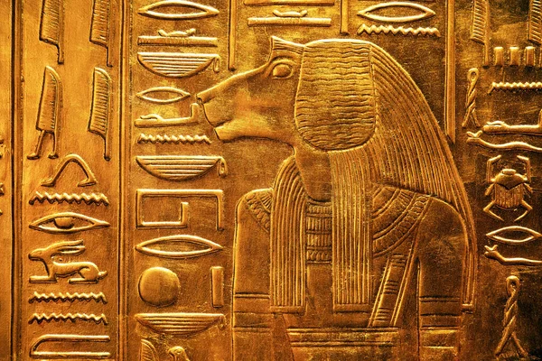 Ancient egyptian god depicted as a baboon-headed man from Tutankhamun tomb