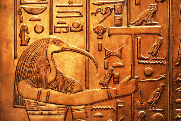 Ancient egyptian god depicted as a ibis-headed man from Tutankhamun tomb