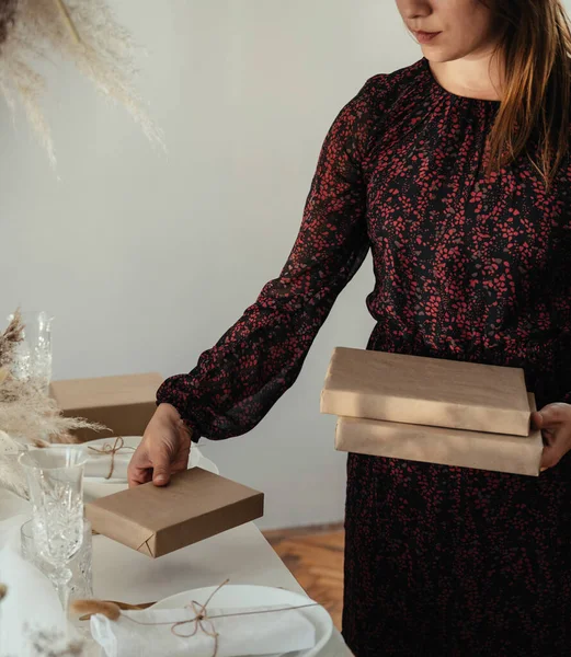 An Anonymous Woman Hosting Elegant Dinner Party And Making Christmas Present