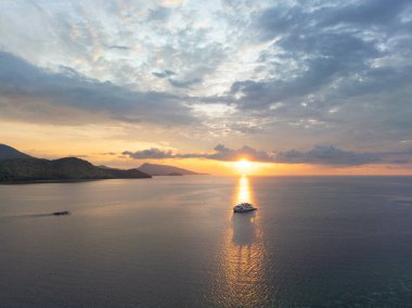 A peaceful sunset shines on a liveaboard dive boat not far from Alor, Indonesia. This beautiful, tropical part of the planet supports the highest marine biodiversity known to exist.